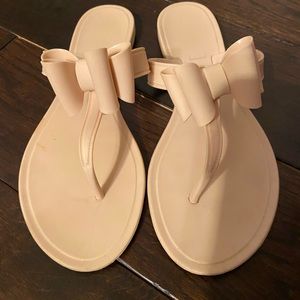 Beige flats with bow detailing